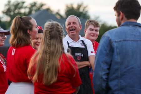 Union president Dub Oliver chats with Union's newest students during the Welcome Week annual ice cream party, hosted at Oliver's house. - Photo by Suzanne Rhodes