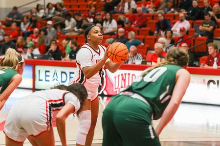Senior Samariah Thompson shoots a free throw during the homecoming basketball game. - Photo by Suzanne Rhodes