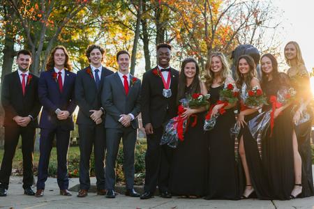 The 2022 Union homecoming court poses by the Buster statue. - Photo by Suzanne Rhodes