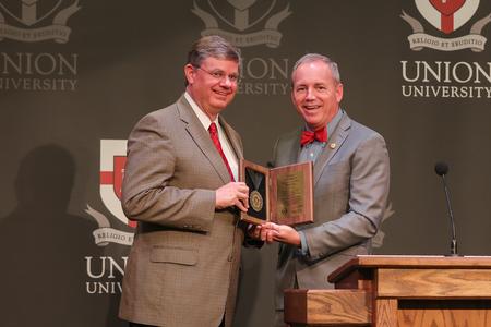 President Dub Oliver presented Tom McAfee with his Bicentennial Hall of Honor medallion at the conclusion of the McAfee School of Business' Faith in the Marketplace luncheon. - Photo by Suzanne Rhodes