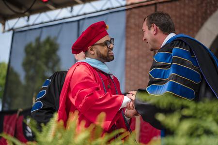 5/6/23 - Andrew Courtner, associate dean for the College of Education, congratulates Brian Michael Ingram after Brian was conferred with the Doctor of Education at Spring Graduation. - Kristi McMurry Woody