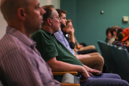 4/18/23 - Randy Schwindt, professor of engineering, takes in presentations by engineering students during the 2023 UUSS. - Eli Creasy