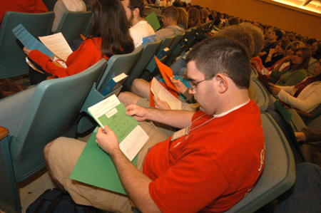 An incoming freshman looks over a collection of registration forms during the Spring Thing weekend. - Photo by Morris Abernathy