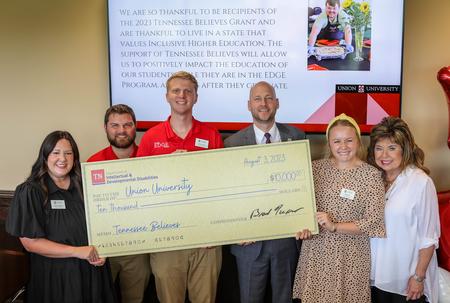 Commissioner of the Tennessee Department of Intellectual and Developmental Disabilities, Brad Turner (center right), presents a grant to the Union EDGE Program from Tennessee Believes. EDGE Program Director Rebecca Holloway (far left) accepted the check alongside fellow EDGE staffers (from left to right): Grant Gammon, Jonathan Lafferty, Sydney Bond, and Denise Bell. - Photo by Karley Hathcock