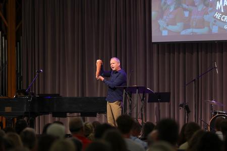 President Oliver shows off his monogrammed towels from his time in college during the Blessings Chapel. - Photo by Karley Hathcock