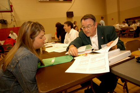 Chemistry professor Charles Baldwin advises an incoming freshman during the Spring Thing weekend. - Photo by Morris Abernathy