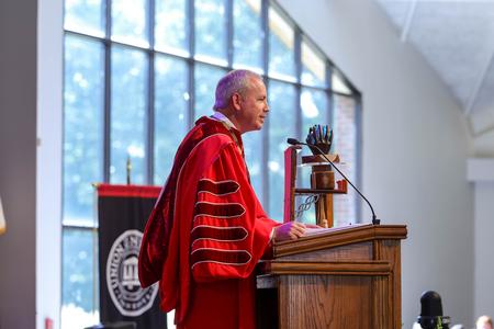 President Oliver speaks in Fall Convocation on the focal verse for the upcoming year - Genesis 1:27. - Photo by Karley Hathcock