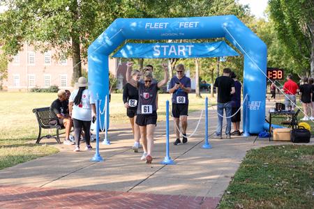 Sophomore Sydnie Arnolds and her family finish Buster's Annual 5K Dash during Family Weekend. - Photo by Karley Hathcock