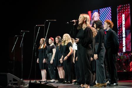 Sophomore Ashtyn Delk takes the lead for the University Singers as they perform at the 25th annual Scholarship Banquet. - Photo by Kristi McMurry Woody