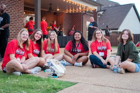 New Bulldogs enjoy fellowship at President Oliver's home during Welcome Week. - Photo by Lauren Steed