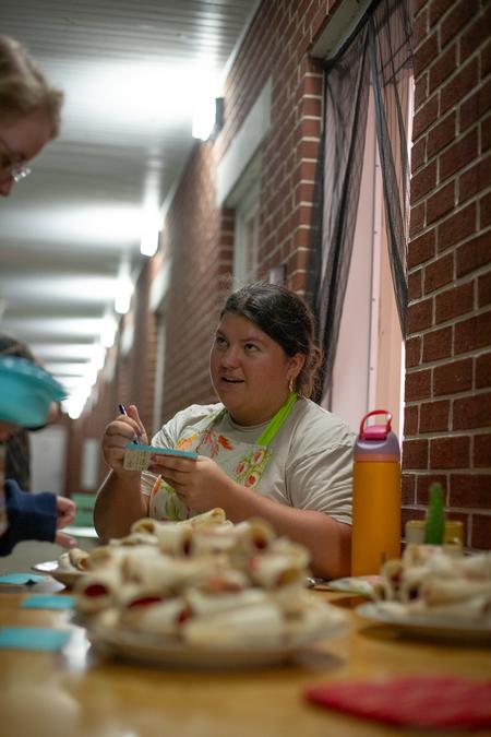 Gailey Hollingsworth, Assistant RD for the Women's Quads, serves up some tasty treats for Progressive Snacking. - Photo by Lindsey Atwood