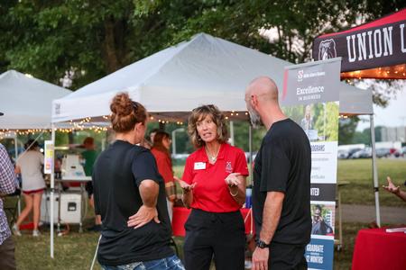 9/30/23 - The Union community enjoyed getting to interact with various departments on campus at Union Night during Family Weekend. Here parents get a chance to speak with Karen Miller, dean for the McAfee School of Business. - Karley Hathcock