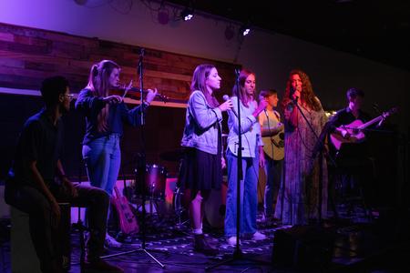 A group of students perform during an Open Mic Night in Barefoots. - Photo by Lindsey Atwood