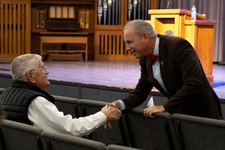 President Oliver greets community members before the evening address of 2023 Carls-Schwerdfeger History Lecture featuring Alan Taylor. - Photo by Lauren Steed