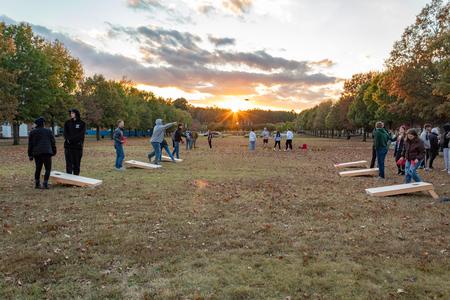 Students play corn hole and other games on the Great Lawn to celebrate Buster's retirement during Homecoming 2023.   - Photo by Lyla Dietz