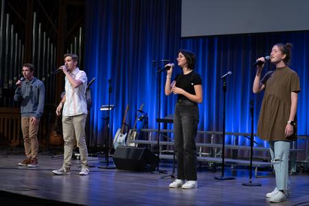 Members of the Worship Lab (Ethan King, Isaac Reid, Makenzie Slauson, and Esther Noeth) lead in worship during the fall Worship Choir Concert. - Photo by Kristi McMurry Woody