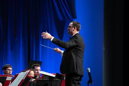 DJ Culp, associate professor of music, leads the Symphonic Band during their fall concert. - Photo by Kristi McMurry Woody