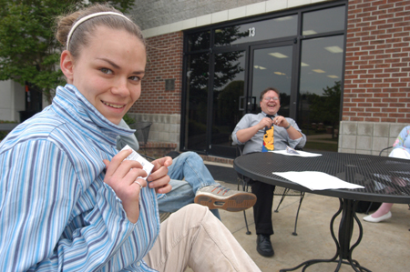 Sophomore Julie Palmer, theatre/speech major, prepares to participate in the Symposium with her creative writing class. The class read original works aloud outside the SUB. - Photo by Kristen Nicole Sayres