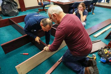 10/31/23 - Professors Justin Wainscott and Mark Dubis assemble furniture at West Jackson Baptist Church during Campus and Community Day. - Karley Hathcock