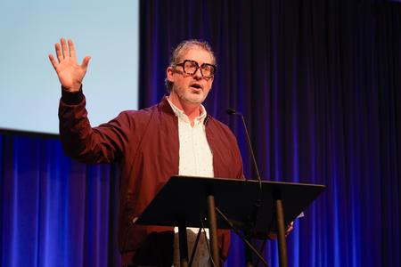 12/1/23 - Ted Kluck, associate professor of communication arts, speaks to students during the Faculty Member of the Year chapel service. - Lauren Steed