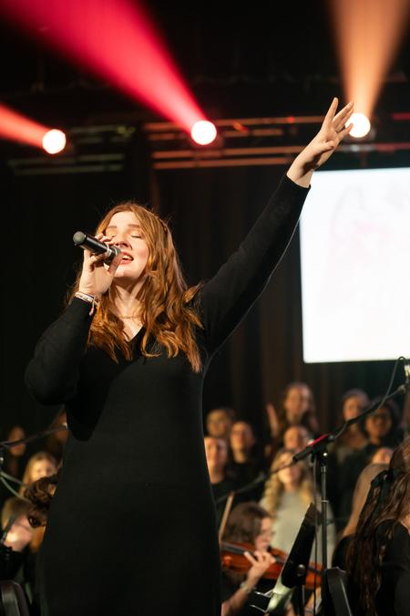 Jordyn St. John sings along with her fellow music students
