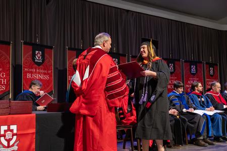 12/14/24 - Rachel Mosely receives her Master of Science in Nursing degree from President Oliver during fall graduation. - Karley Hathcock