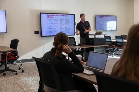 Duncan Nicol, associate professor of marketing, teaches in a new classroom space in The Ethos Forum shortly after its dedication. - Photo by Karley Hathcock