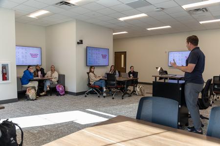 Duncan Nicol, associate professor of marketing, teaches in a new classroom space in The Ethos Forum shortly after its dedication. - Photo by Karley Hathcock