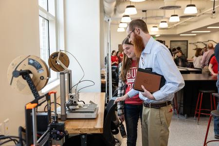 Students, alumni, donors, and guests check out the new 3D printers in The HUB during The Ethos Forum dedication. - Photo by Jim Gandy