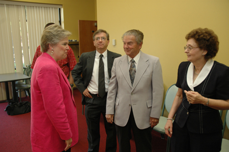 First Lady Lanese Dockery speaks with facilities management's Pat Patterson and his family during his retirement reception. - Photo by Jim Veneman
