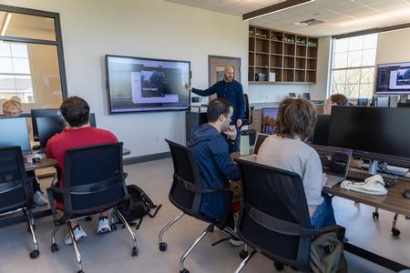 Brian Glas, chair of the Department of Computer Science, teaches in a new computer lab in The Ethos Forum shortly after its dedication. - Photo by Karley Hathcock