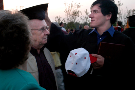 Theatre graduate Patrick Myers celebrates with his family shortly after the graduation ceremony. - Photo by Brad Moore