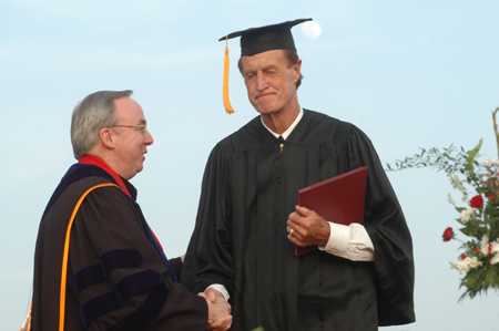 President David S. Dockery congratulates Bobby Morris on completing his degree. - Photo by Jim Veneman