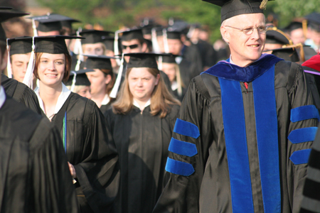 The graduate and faculty processional lines prepare to diverge at spring graduation. - Photo by Kyle Kurlick