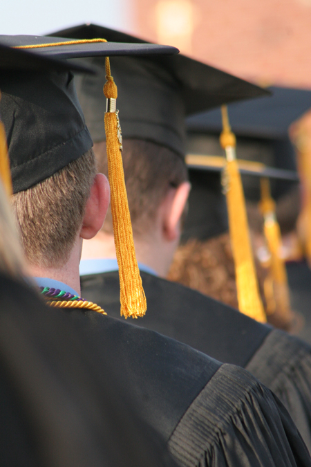 Golden tassles hang from the caps of graduates. - Photo by Kyle Kurlick