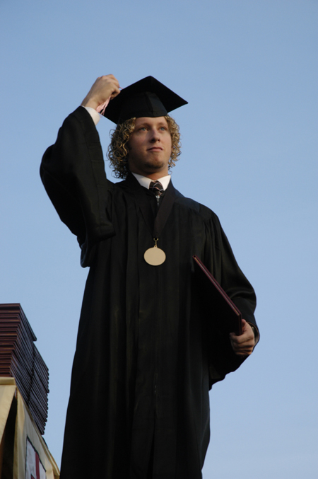 Music theory graduate Jeremy Warner moves his tassle after receiving his bachelor of music degree at spring graduation. - Photo by Kathleen Murray