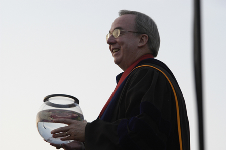 President Dockery holds on to the miniature version of the aquarium presented by the senior class that is to be housed in White Hall.  - Photo by Kathleen Murray
