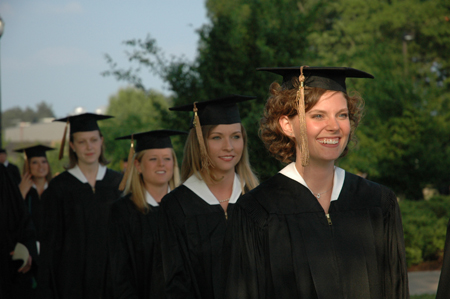 Business graduates Lauren Oldham, Holly Ragan, Natalie Reynolds and Jessica Rudy file onto the Great Lawn during spring graduation. - Photo by Kristen Nicole Sayres