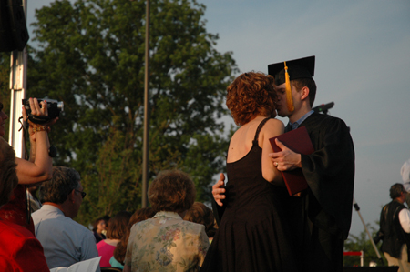 A graduate gets a special recognition after receiving his diploma at spring graduation. - Photo by Kristen Nicole Sayres