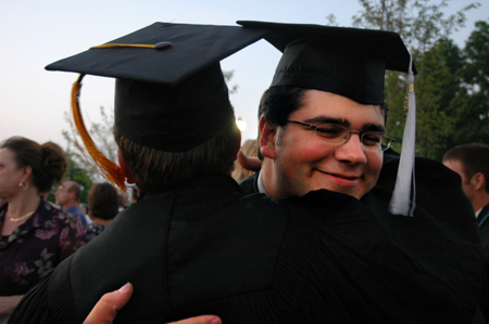 Broadcasting graduate Jonathan Yorkowitz gets a congratulatory hug after the spring graduation ceremony. - Photo by Kristen Nicole Sayres