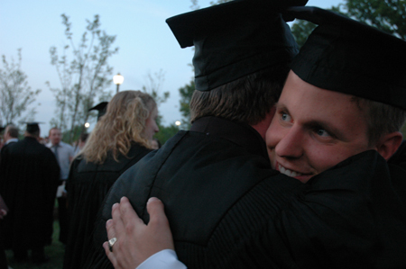 Youth ministry graduate Ryan Martin gets a congratulatory hug after the spring graduation ceremony. - Photo by Kristen Nicole Sayres