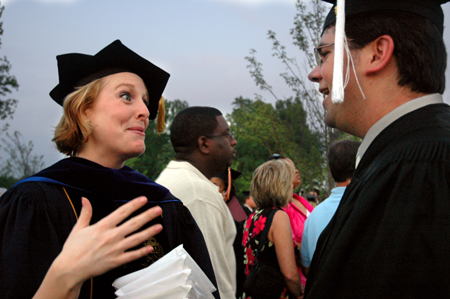 Dean of Students Kimberly Thornbury talks to the overly photographed Jonathan Yorkowitz following the spring graduation ceremony. - Photo by Kristen Nicole Sayres