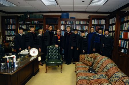 President Dockery poses with the graduation ceremony participants - Brandon Nelms, senior class president; Terry Weaver, father of graduate Carol Lee Weaver; Melinda Jordan, mother of graduate Donald Jordan; Steve Gaines, father of graduate Grant Gaines & pastor of Gardendale Baptist Church; R. Albert Mohler Jr., commencement speaker & president of Southern Baptist Theological Seminary; Carla Sanderson, provost; Louis Murphy, father of graduate Katie Murphy; Chris Hail, faculty member of the year; & Brad Spencer, SGA president.  - Photo by Morris Abernathy