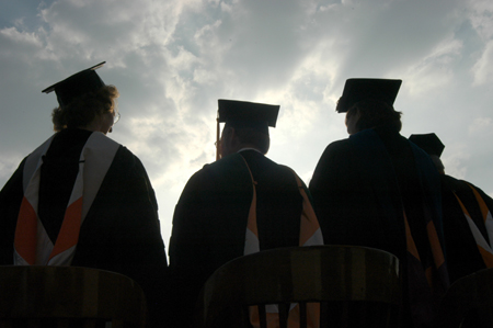 Melinda Jordan, Louis Murphy and Carla Sanderson take the stage for spring graduation. - Photo by Morris Abernathy