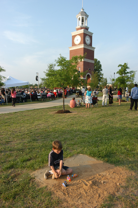 Not everyone was focused on the events happening on stage during spring graduation. - Photo by Morris Abernathy