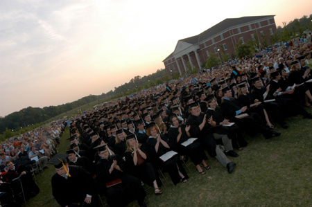 After each of the degrees were conferred, the graduates gave themselves a round of applause. - Photo by Morris Abernathy