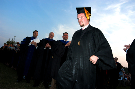 Mathematics and physics graduate Brian Taylor makes his way up to the stage during spring graduation to accept the Tigrett Medal. This Union award has been awarded since 1912 by vote of the entire Union faculty to an outstanding member of the senior class. 
 - Photo by Morris Abernathy