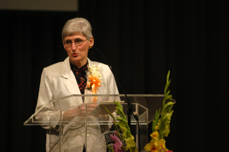 Nursing professor Tharon Kirk welcomes the family & friends of the nursing graduates to the nursing dedication service. - Photo by Morris Abernathy