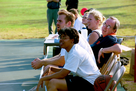 Faculty & Staff members take a break during the Faculty/Staff vs. Student game at the dedication of the Class of 2002 Basketball Court.  Pictured from left to right: Resident Director Bobby Ludwig, Director of Career Services Jaqueline Taylor, Women's Basketball Assistant Coach Katie Woodruff, and President David S. Dockery. - Photo by Justin Veneman