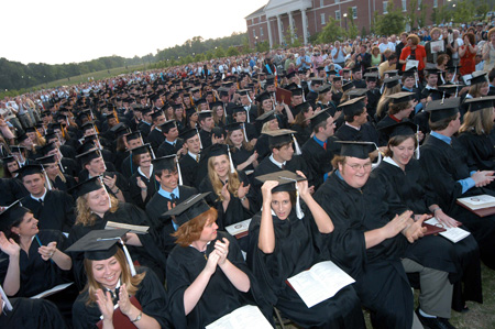Friends and familes give the Class of 2005 a standing ovation during spring graduation. - Photo by Morris Abernathy